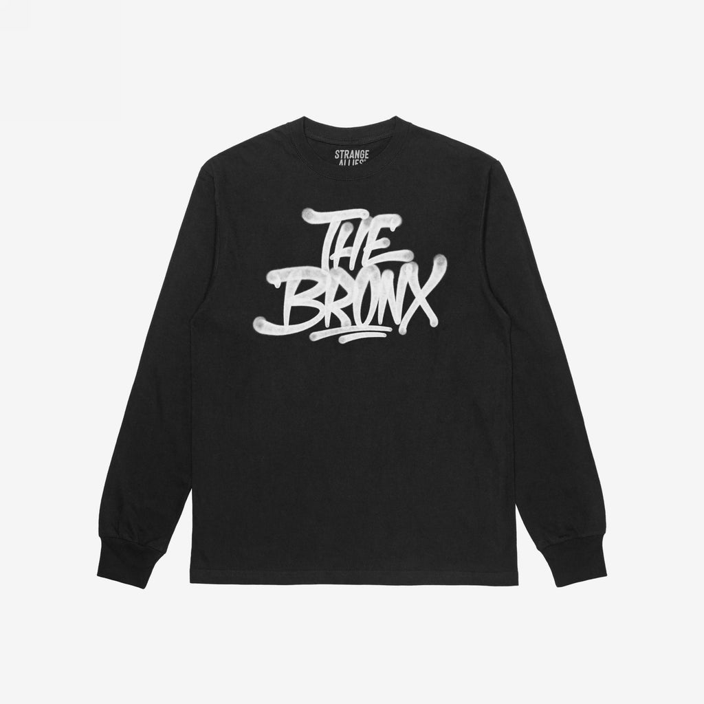 Bronx Handstyle T-shirt features a bold, graffiti-style “THE BRONX” graphic, perfect for showcasing NYC pride. The inside neck label reads “STRANGE ALLIES,” reflecting the store’s commitment to equality and inclusivity.