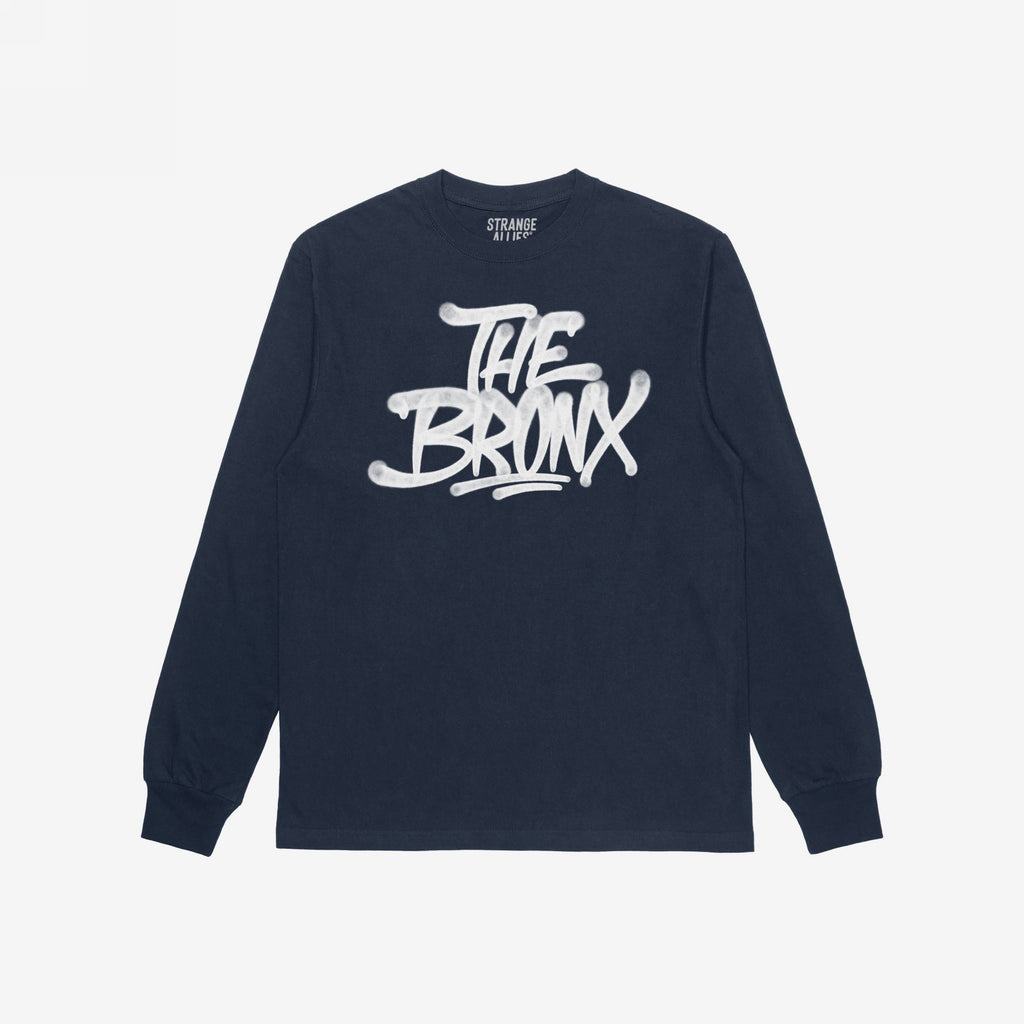 Navy Bronx Handstyle T-shirt featuring white graffiti-style THE BRONX lettering with drips, ribbed cuffs, and crew neckline, embodying urban pride and rebellious spirit.