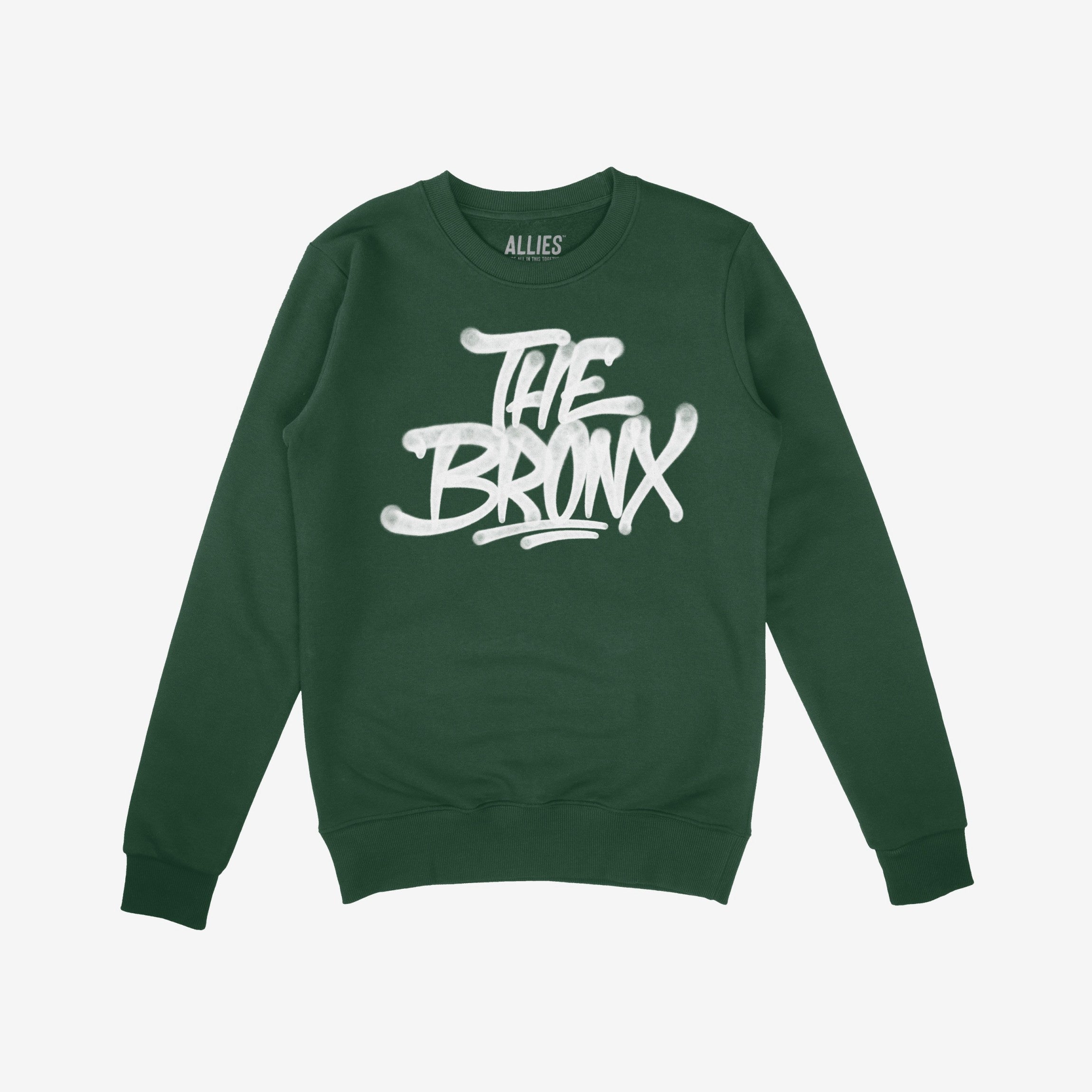 Bronx Handstyle Hoodie & Sweatshirt features a forest-green crewneck with a white, graffiti-style THE BRONX graphic, embodying raw borough pride and resilience for NYC enthusiasts and locals.