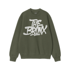 Bronx Handstyle Hoodie & Sweatshirt features a forest-green crewneck with a white, graffiti-style THE BRONX graphic, embodyin