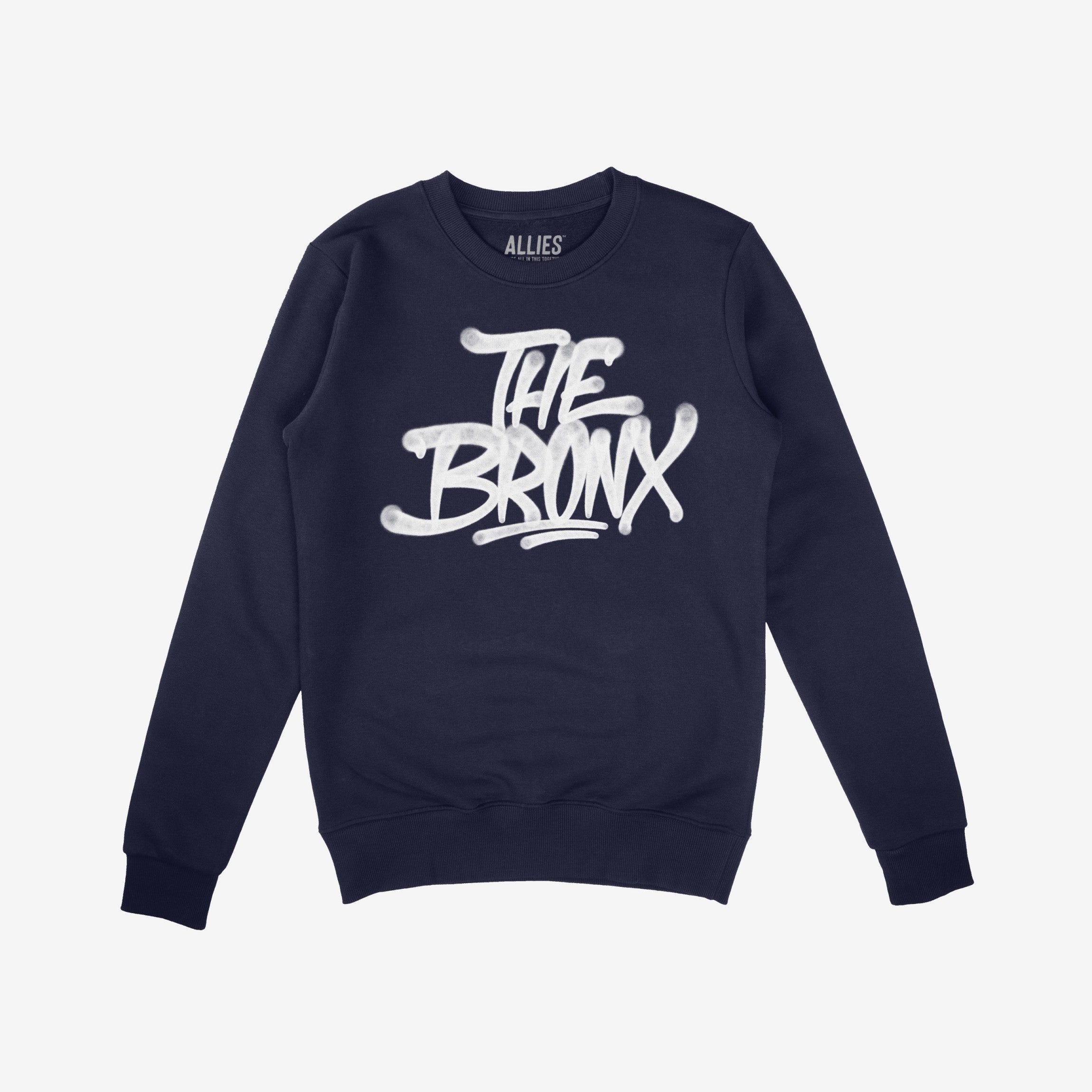Navy-blue Bronx Handstyle Hoodie & Sweatshirt with “THE BRONX” in white graffiti font, embodying urban pride and resilience suitable for NYC winters, reflecting the store's values of equality and support.