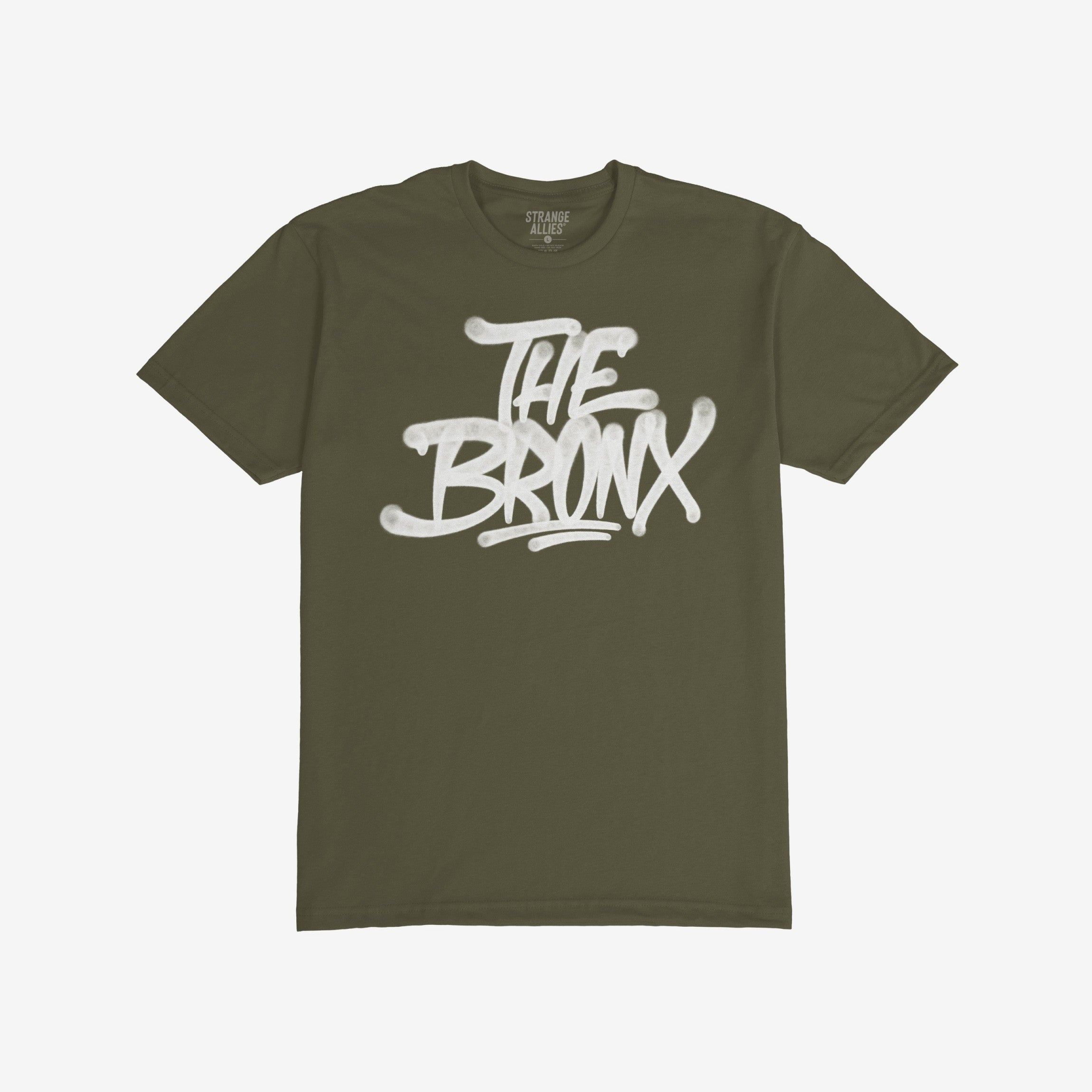 Bronx Handstyle T-shirt featuring bold white graffiti text THE BRONX on olive-green fabric, embodying raw urban pride and rebellion, perfectly aligned with the ethos of equality and anti-fascism.