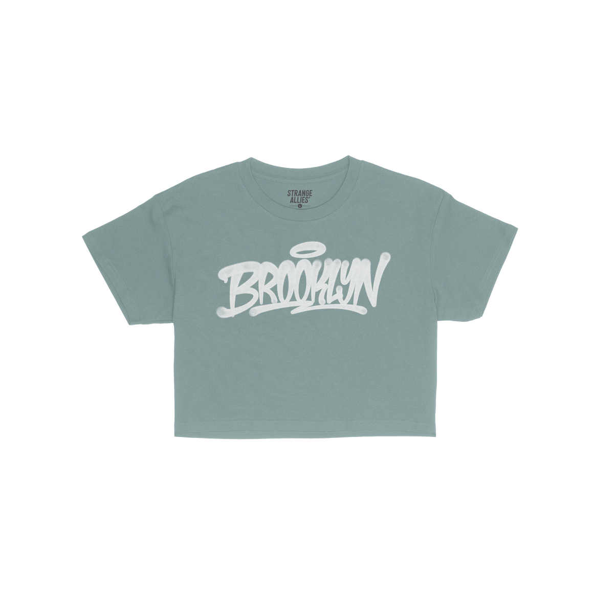 Brooklyn Handstyle Women's Baby Tee in blue, featuring BROOKLYN in white graffiti script with a halo accent, embodies urban s