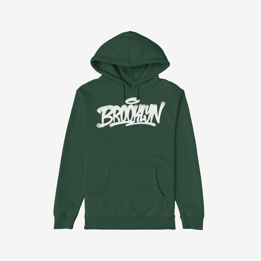 Brooklyn Handstyle Hoodie, featuring a dark green pullover with kangaroo pocket and drawstrings, showcases bold white graffiti-style Brooklyn script, embodying cultural pride and individuality.