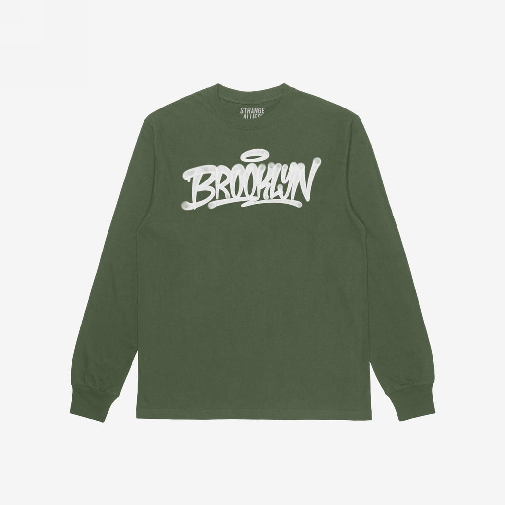 Olive-green Brooklyn Handstyle T-shirt featuring a white graffiti-style BROOKLYN logo with a halo accent across the chest, embodying urban pride and designed by Strange Allies for versatile, everyday wear.