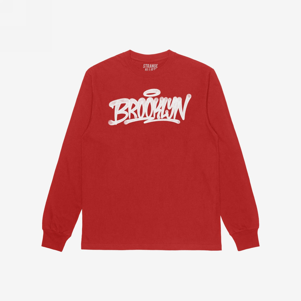 Red Brooklyn Handstyle T-shirt by Strange Allies, featuring long sleeves and a graffiti-style Brooklyn script across the chest, laid flat on a white background. Ideal for showcasing borough pride.