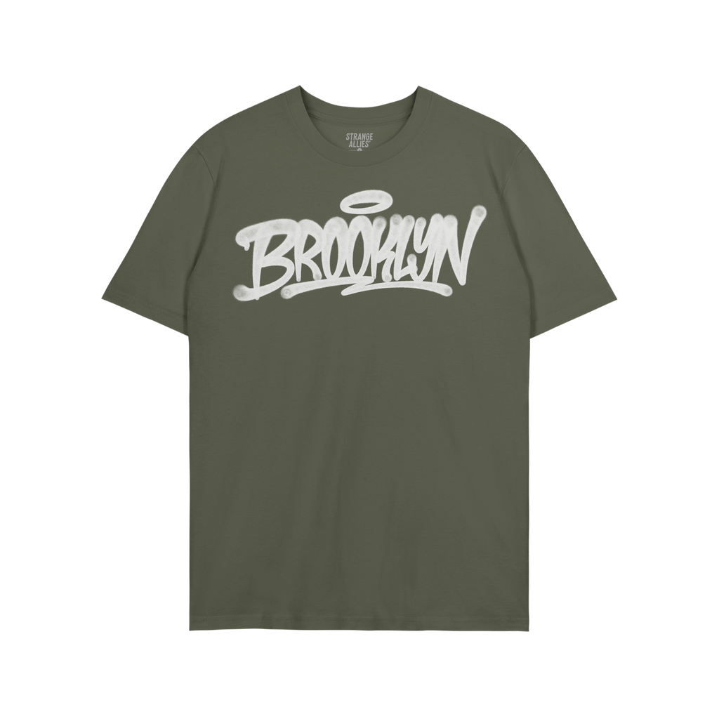 Army-green Brooklyn Handstyle T-shirt with bold white graffiti script, BROOKLYN, across the chest. Label reads “STRANGE ALL