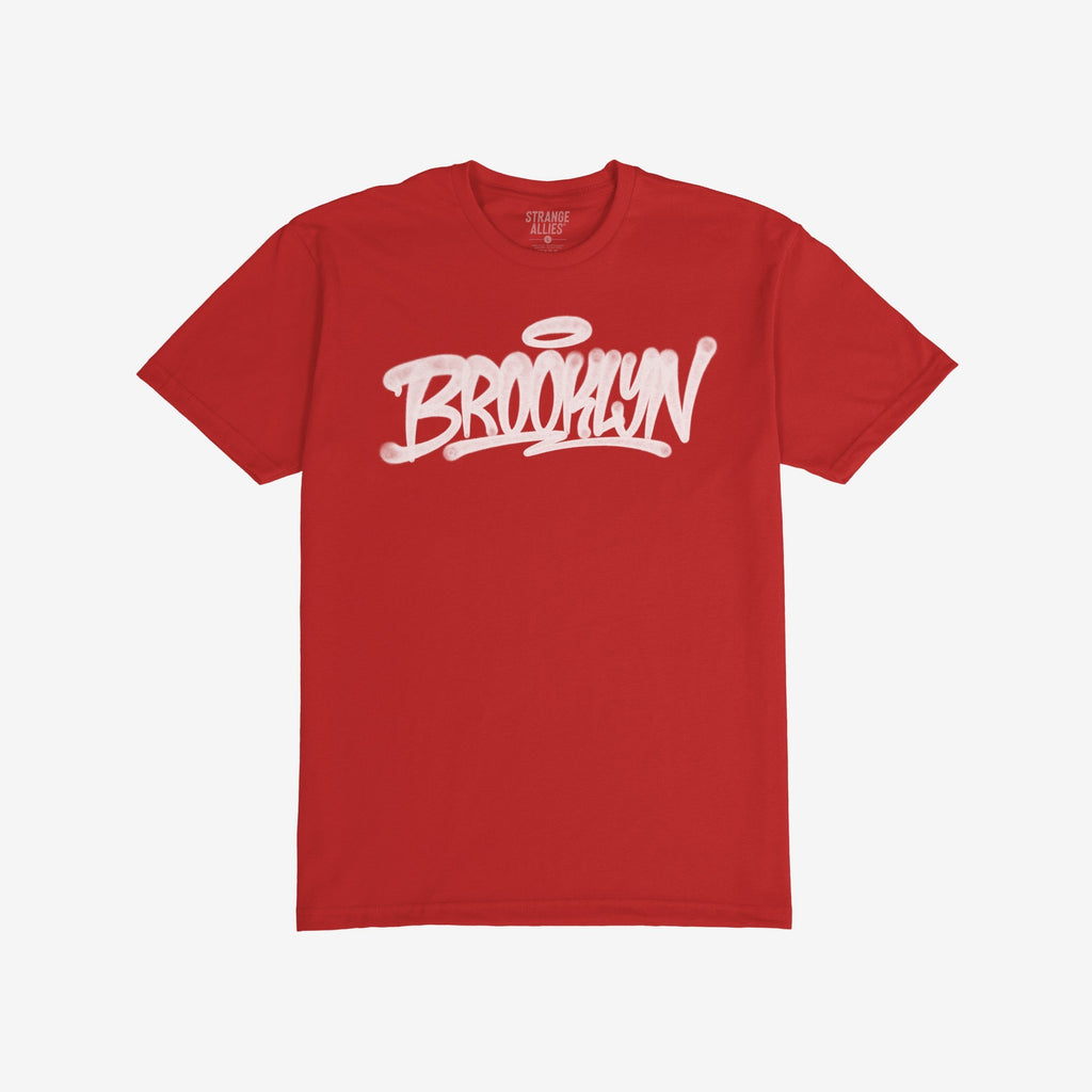 Brooklyn Handstyle T-shirt featuring a white graffiti-style BROOKLYN graphic with a halo, highlighting borough pride and urban culture, designed for everyday wear. Label inside reads STRANGE ALLIES.