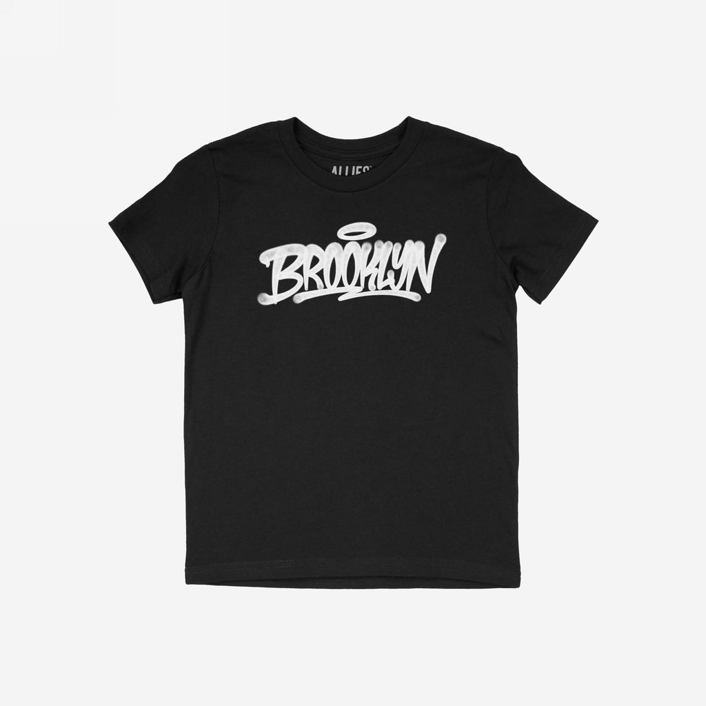 Brooklyn Handstyle T-shirt showcasing a black short-sleeve design with white graffiti-style BROOKLYN and halo accent on the chest. Ideal for expressing borough pride and supporting equality.