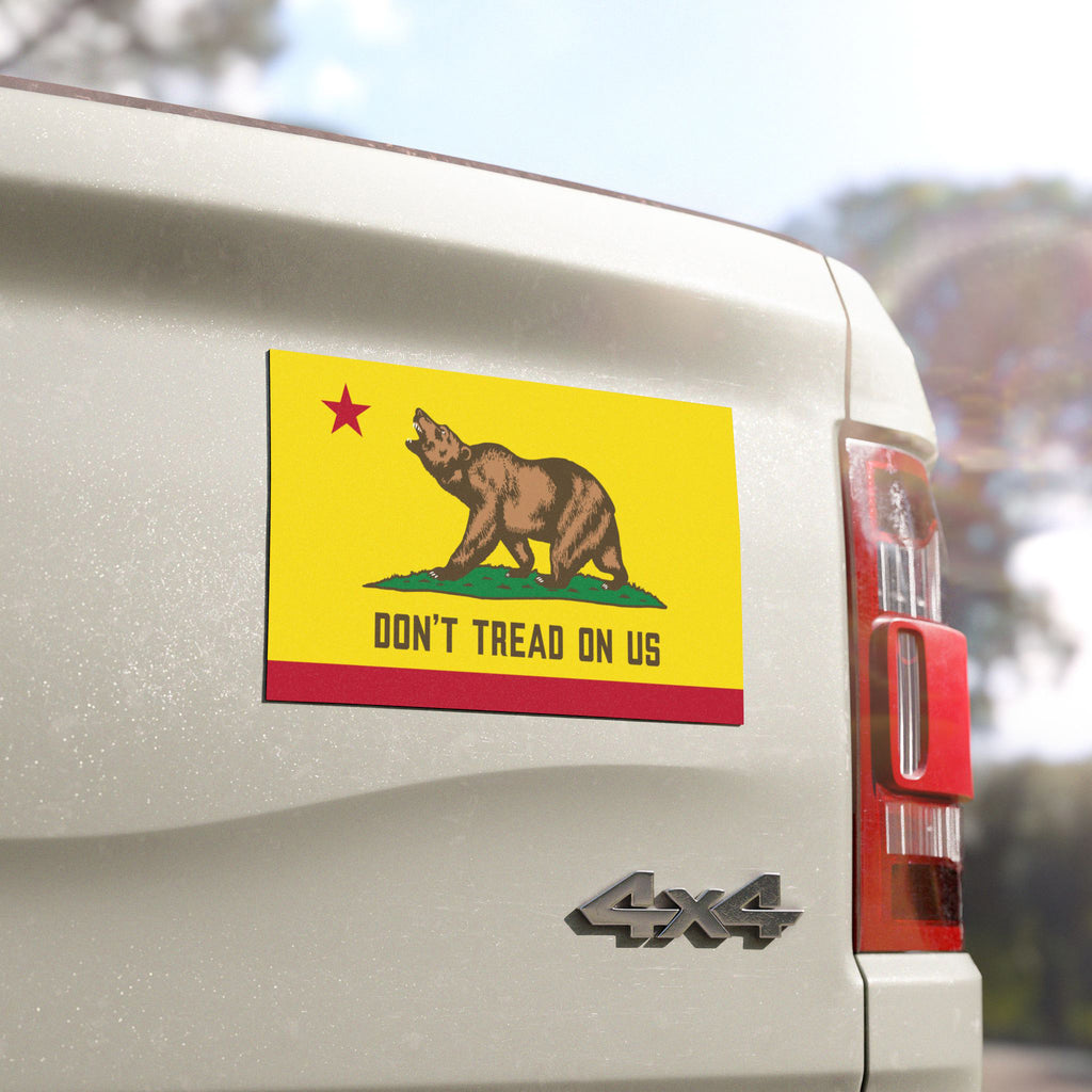 California Gadsden Flag Sticker & Magnet on a white 4×4 pickup's tailgate, featuring a bear and DON’T TREAD ON US,” symbolizing California pride and resistance against oppression.