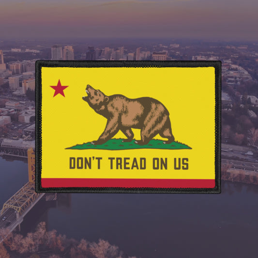 California Gadsden Flag Patch featuring a walking bear on green ground with a red star, bold DON’T TREAD ON US message on a red stripe; embodies defiance and state pride.