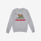 Heather-gray crewneck sweatshirt featuring the California Gadsden Flag Shirt design: a bear on grass, red star above, “DON’T TREAD ON US” slogan below, symbolizing protest and state pride.