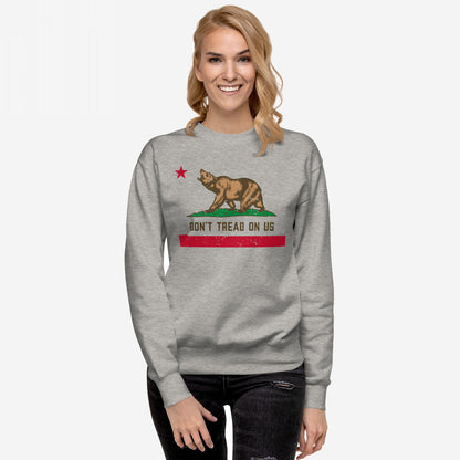 California Gadsden Flag Hoodie & Sweatshirt features a stylized bear on grass with a red star, DON’T TREAD ON US text, and distressed stripe, embodying anti-authoritarian spirit.