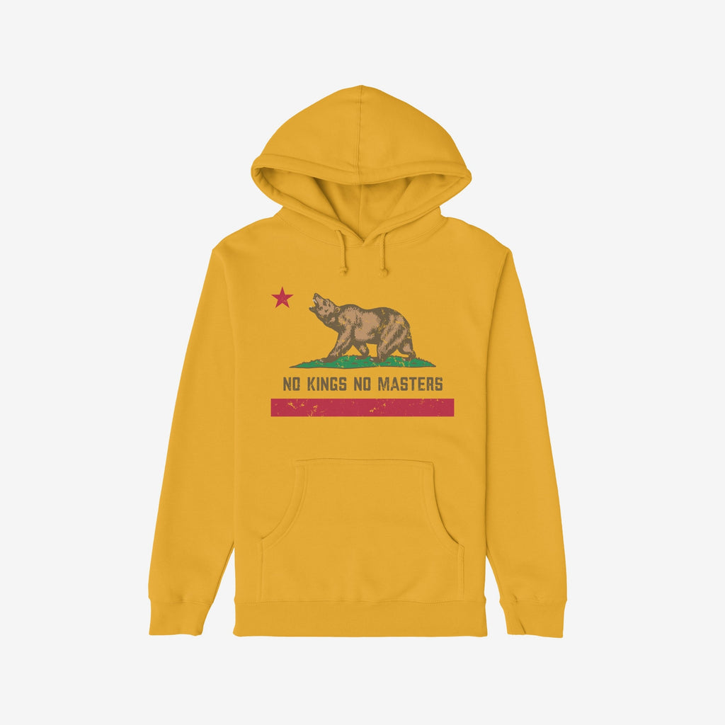 California No Kings Flag Shirt: Mustard-yellow hoodie with a distressed California bear flag graphic, featuring the slogan NO KINGS NO MASTERS, drawstring hood, and kangaroo pocket, symbolizing autonomy and rebellion.