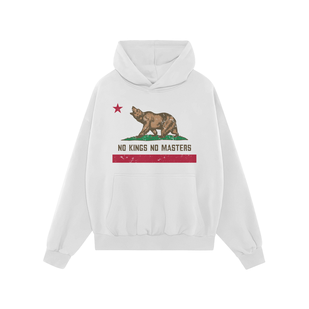 White hoodie featuring the California No Kings Flag Shirt design: a roaring bear on grass, red star above, slogan “NO KINGS
