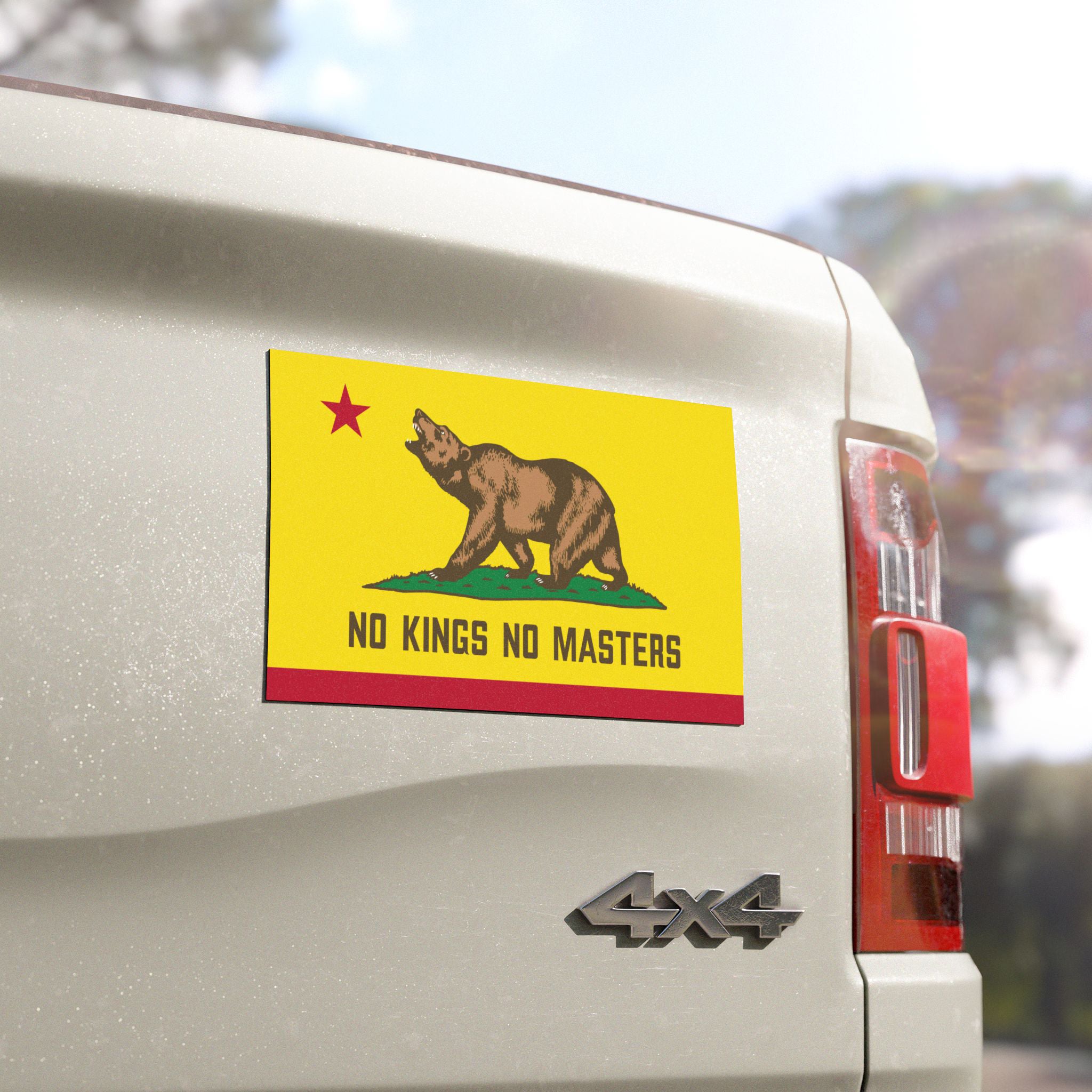 California Flag No Kings Sticker & Magnet close-up on a white 4×4 tailgate, featuring a bear, red star, and NO KINGS NO MASTERS slogan, symbolizing freedom and resistance.
