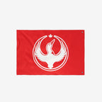 The Canada Rebel Alliance Flag displays a white loon with raised wings inside concentric rings, topped by a maple leaf, symbolizing anti-fascism and community support.