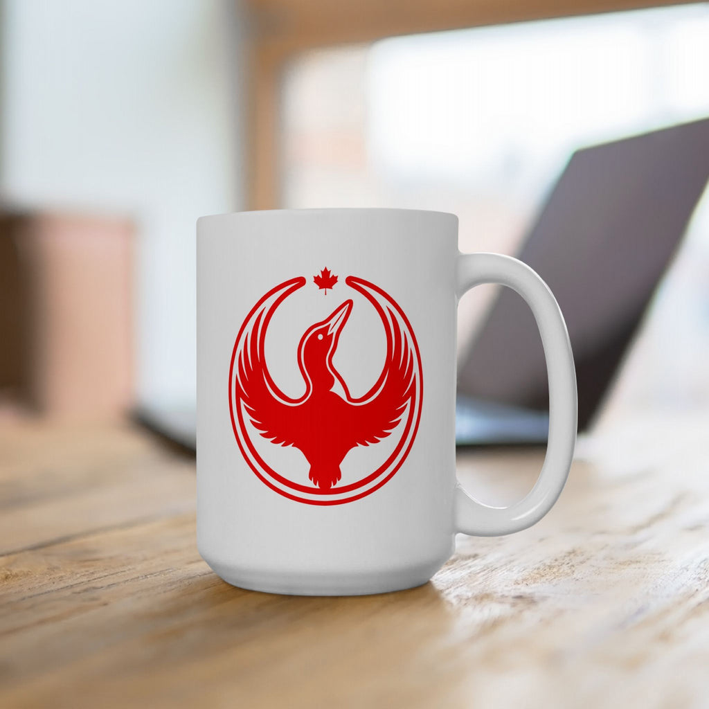 Canada Rebel Alliance Mug featuring a red bird emblem with raised wings and a maple leaf, symbolizing anti-fascist values. Positioned on a wooden tabletop, ideal for advocates of human rights.