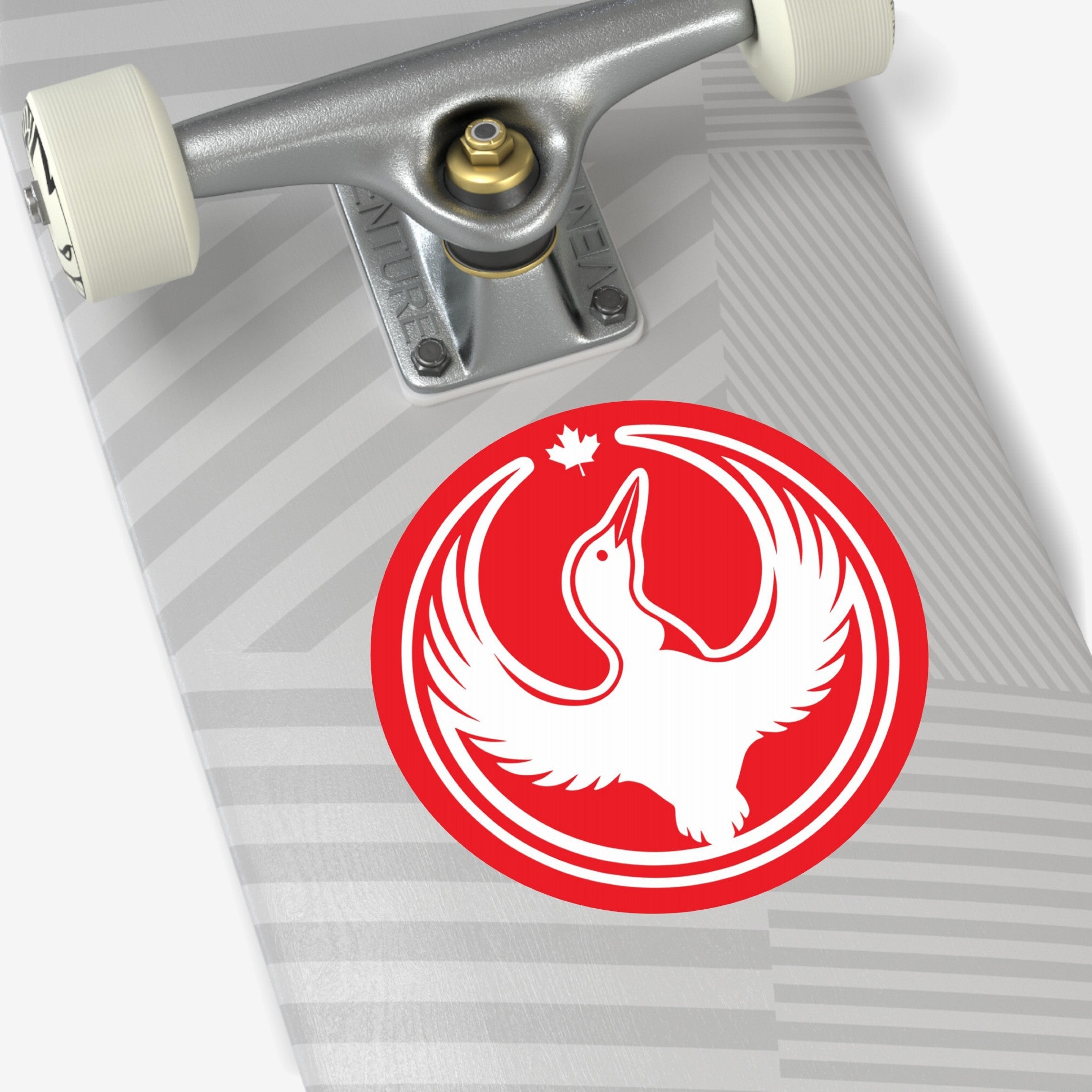 Close-up of a skateboard featuring the Canada Rebel Alliance Sticker, showing a stylized white bird in flight within a bold red circle with a maple leaf above, symbolizing activism and solidarity.