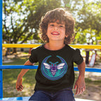 Young boy on playground bars wears a Charlotte Rebel Alliance T-shirt featuring a stylized hornet emblem, embodying anti-fascist and pro-equality values. The black tee is part of the inclusive collection.