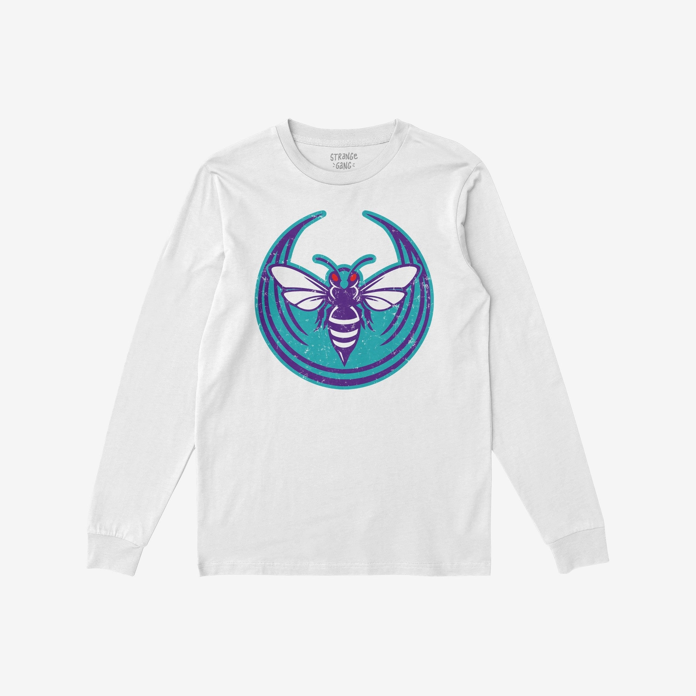 White, long-sleeved Charlotte Rebel Alliance T-shirt featuring a stylized purple and teal bee emblem, embodying anti-fascist and pro-equality sentiments. Inside label reads STRANGE GANG. Suitable for expressive, socially-conscious wearers.