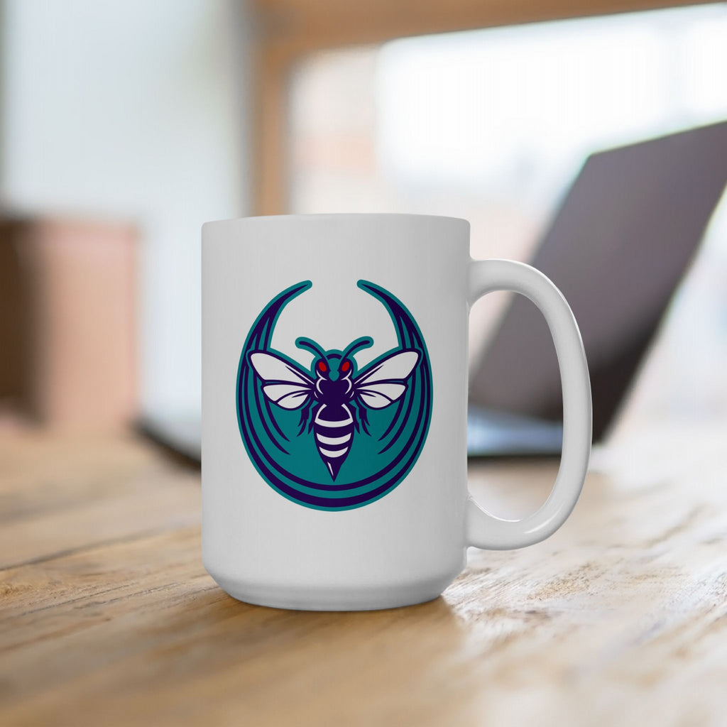 Charlotte Rebel Alliance Mug featuring a hornet logo against a teal backdrop, sitting on a wooden tabletop, ideal for locals and allies committed to equality and anti-fascism. Available in 11 oz. and 15 oz.