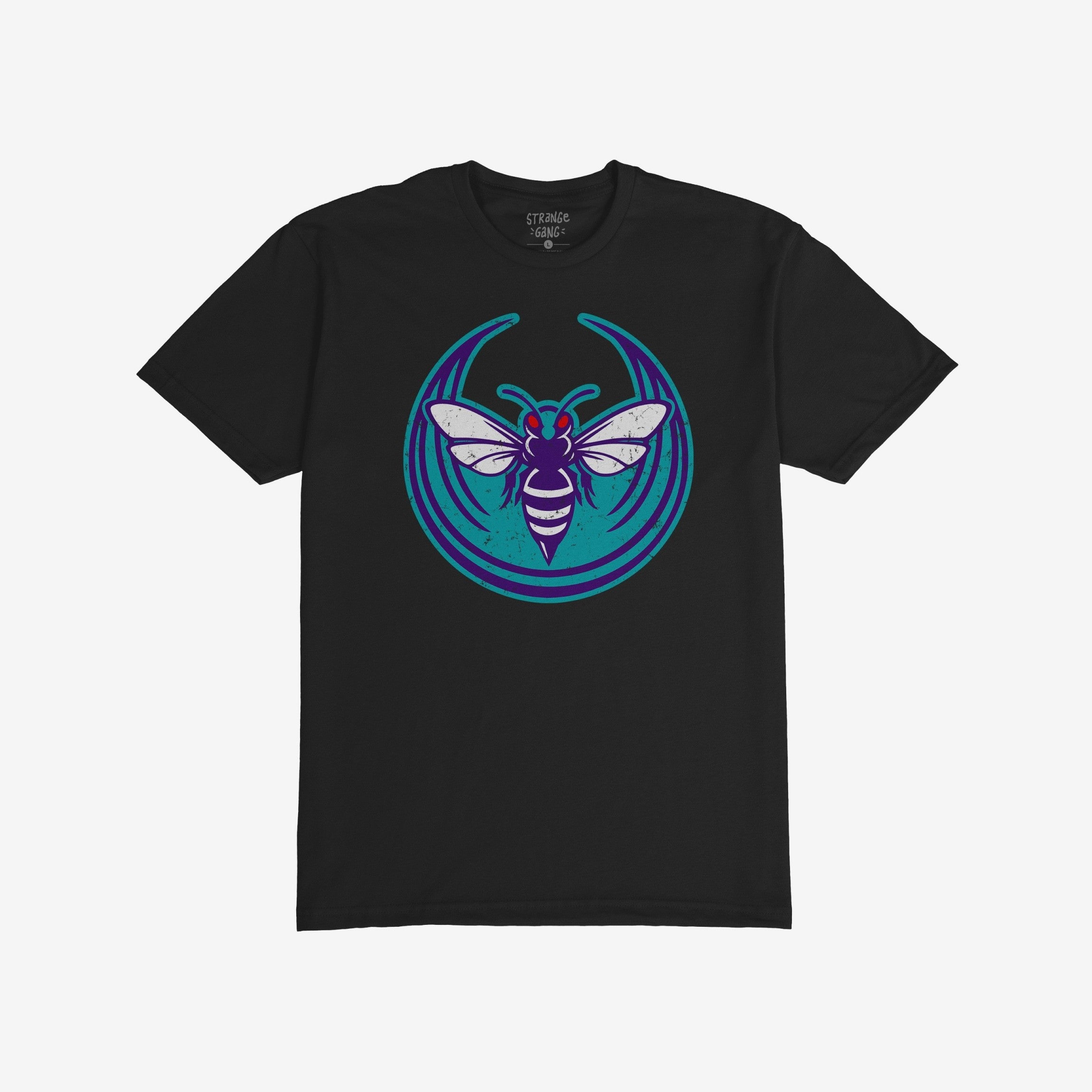 Charlotte Rebel Alliance T-shirt featuring a stylized insect logo with a purple, white-striped body and red eyes on a teal background, embodying anti-fascist and pro-equality messages. Inside collar label reads “STRANGE GANG.”