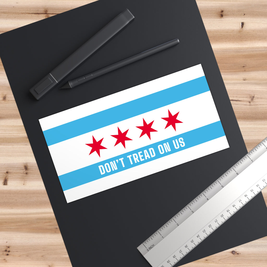 Chicago Gadsden Flag Sticker & Magnet on black desk mat, features DON’T TREAD ON US under four stars, inspired by Chicago flag. Ideal for expressing anti-fascism and Chicago pride.
