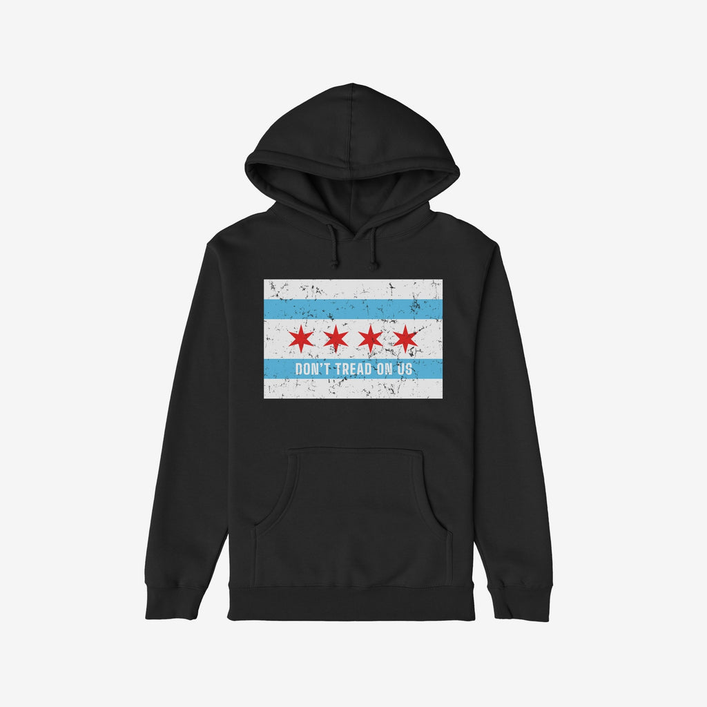 Chicago Gadsden Flag Shirt: Black hoodie with Chicago’s flag and “DON’T TREAD ON US” slogan, symbolizing resistance and community strength. Features a hood and front kangaroo pocket.