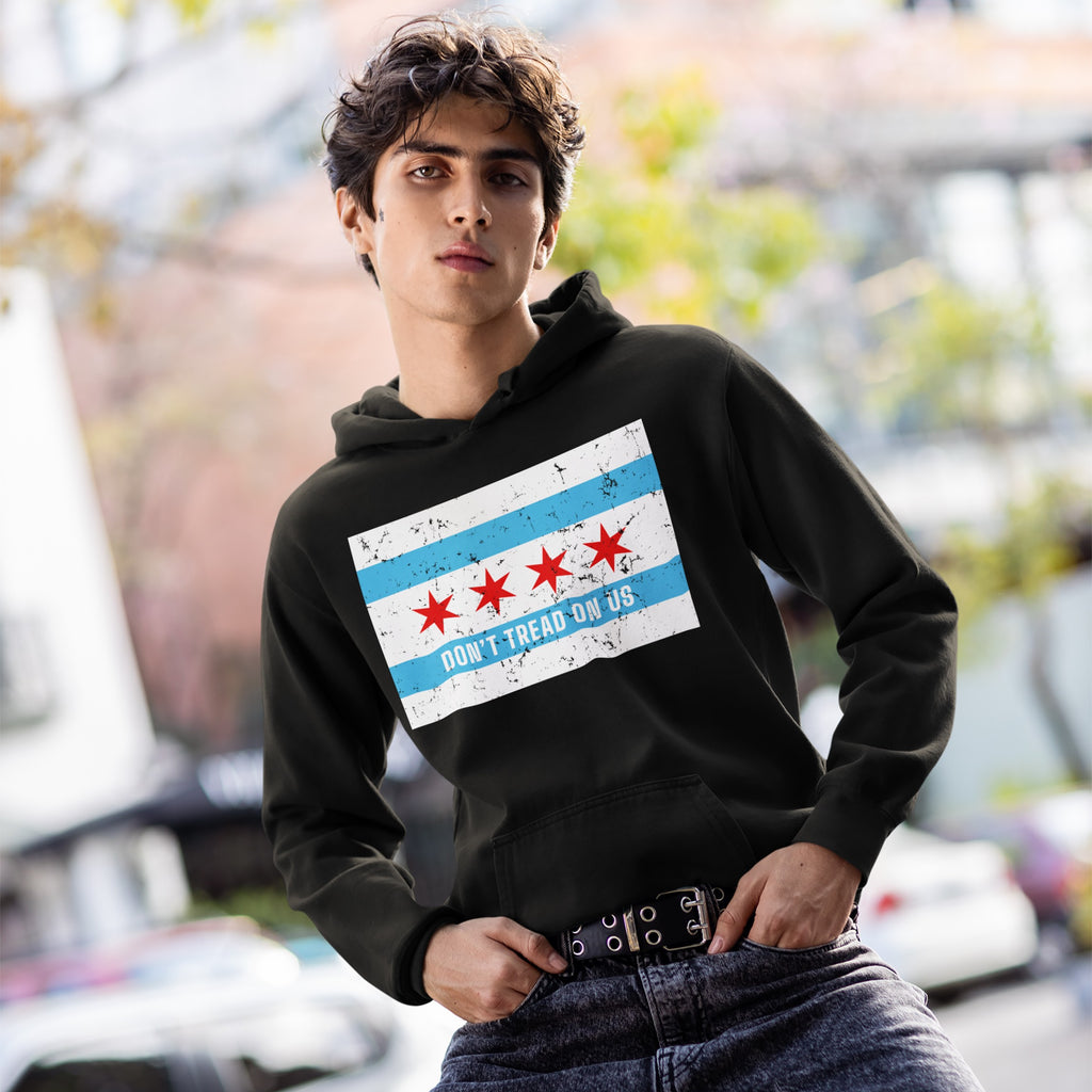 Young model wearing the Chicago Gadsden Flag Shirt, featuring a DON'T TREAD ON US graphic inspired by Chicago's flag, standing outdoors with a neutral expression.