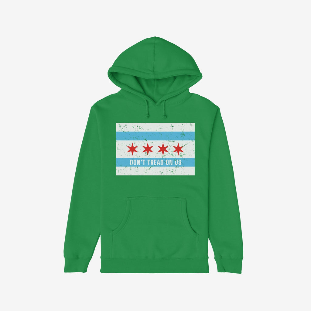 Chicago Gadsden Flag Shirt: Green pullover hoodie featuring a distressed Chicago flag graphic and DON'T TREAD ON US slogan, symbolizing resistance and community strength. Supports Illinois Coalition for Immigrant & Refugee Rights.