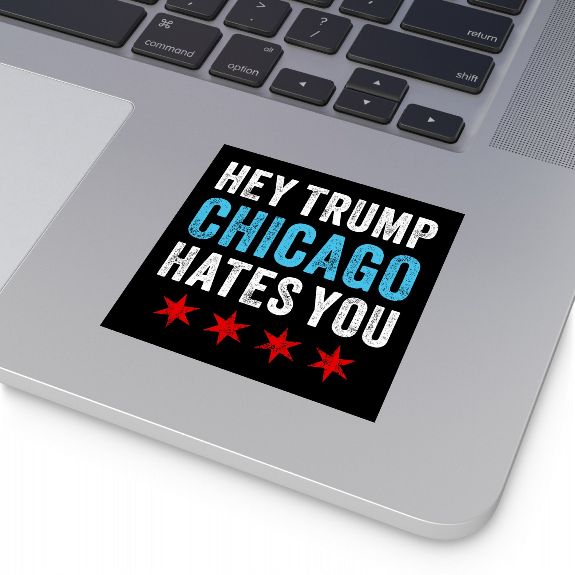 Chicago Hates Trump Sticker & Magnet on a laptop palm-rest features bold text and stars, presenting a statement against MAGA politics and ICE brutality, encapsulating Chicago's activist spirit.