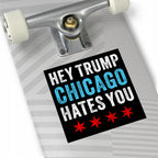 Chicago Hates Trump Sticker & Magnet on a light gray skateboard deck, featuring distressed white and blue text, four red stars, and visible skateboard truck, embodying Midwest resistance and activism.