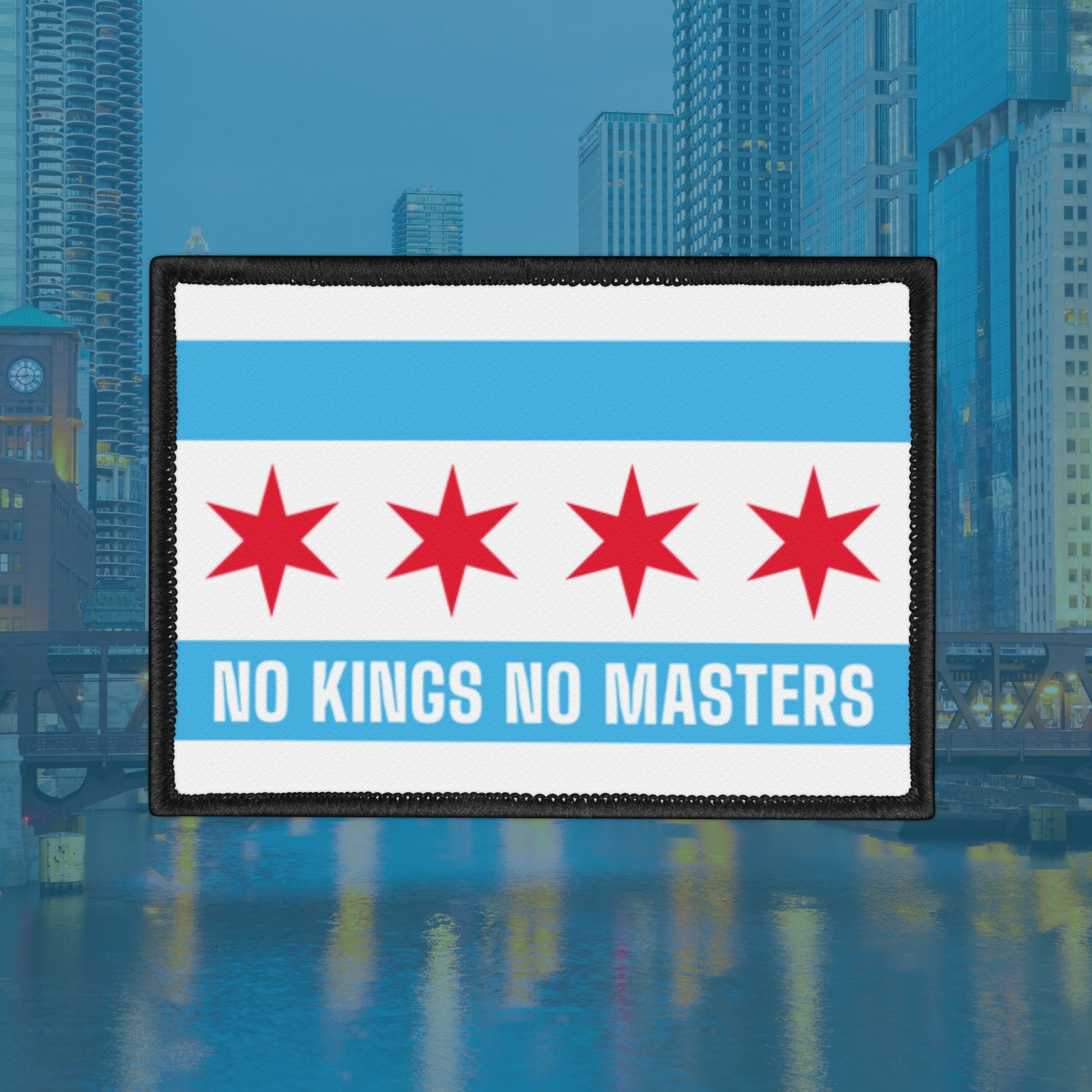 Chicago Flag No Kings Patch featuring the city's flag design with a rebellious twist, showcasing the slogan “NO KINGS NO MASTERS” in bold white lettering on a blue stripe, against a blurred city-river skyline backdrop.
