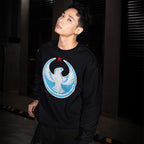 Young man in a Chicago Rebel Alliance Hoodie & Sweatshirt featuring a distressed white eagle and red star graphic, standing confidently in an industrial-style corridor.