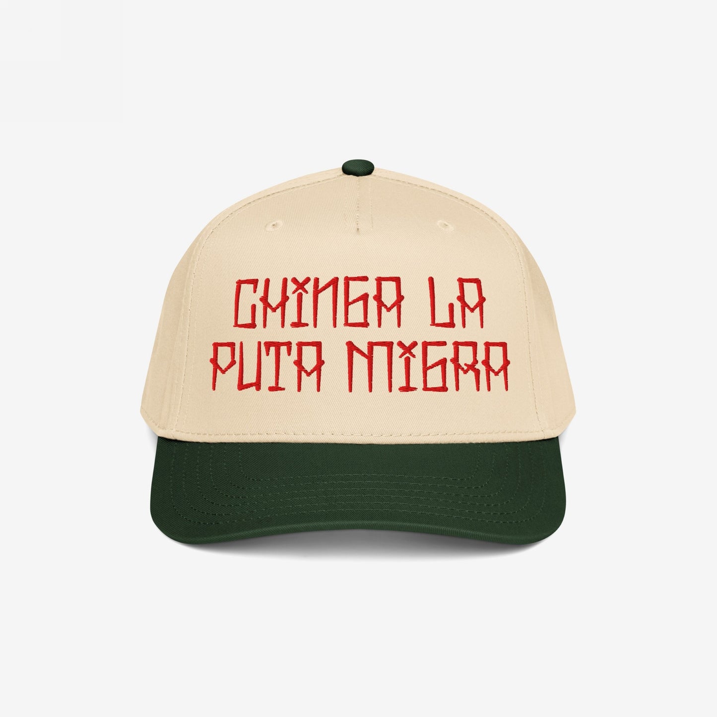 Two-tone Chinga La Migra Hat featuring a beige crown and dark green brim, embroidered with bold red Spanish text, embodying defiance against oppression and supporting equality and resistance movements.