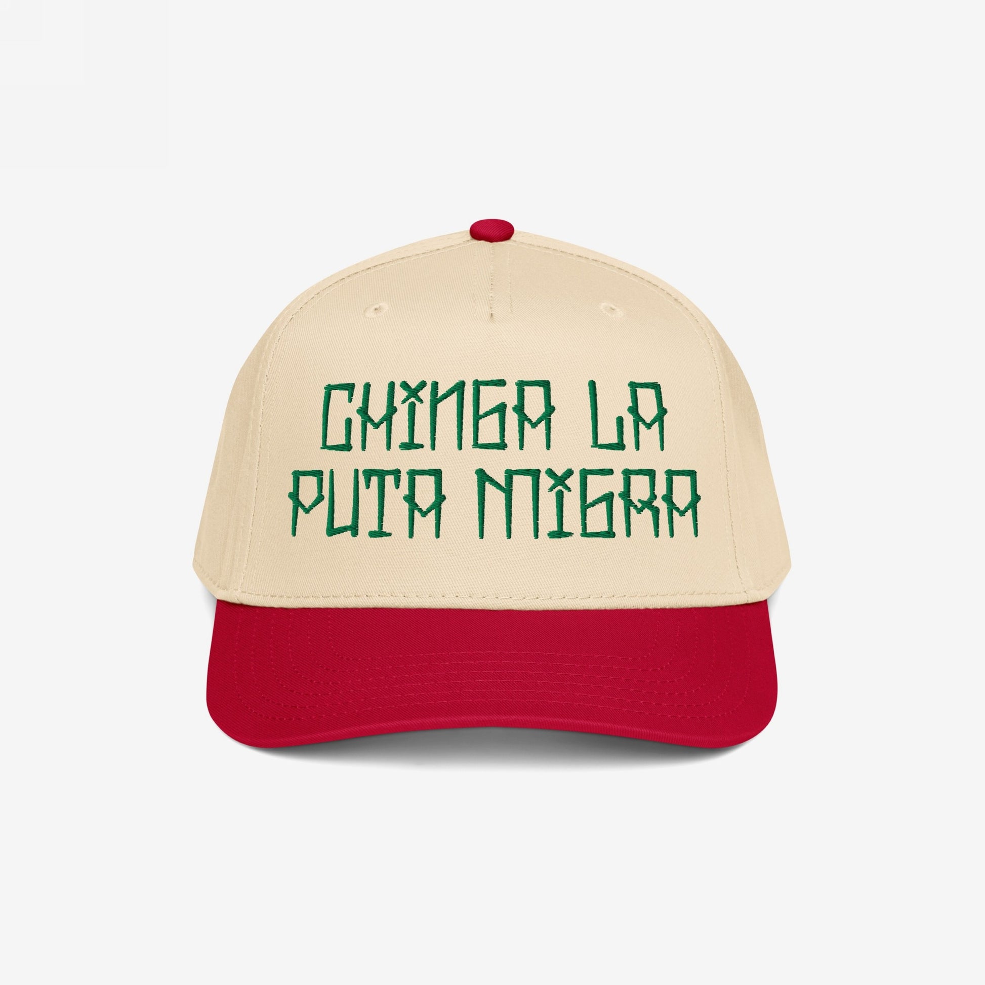 Two-tone Chinga La Migra Hat featuring green embroidered phrase on light cream crown with bright red bill, embodying defiance against oppression and injustice, aligned with the store's commitment to resistance and equality.