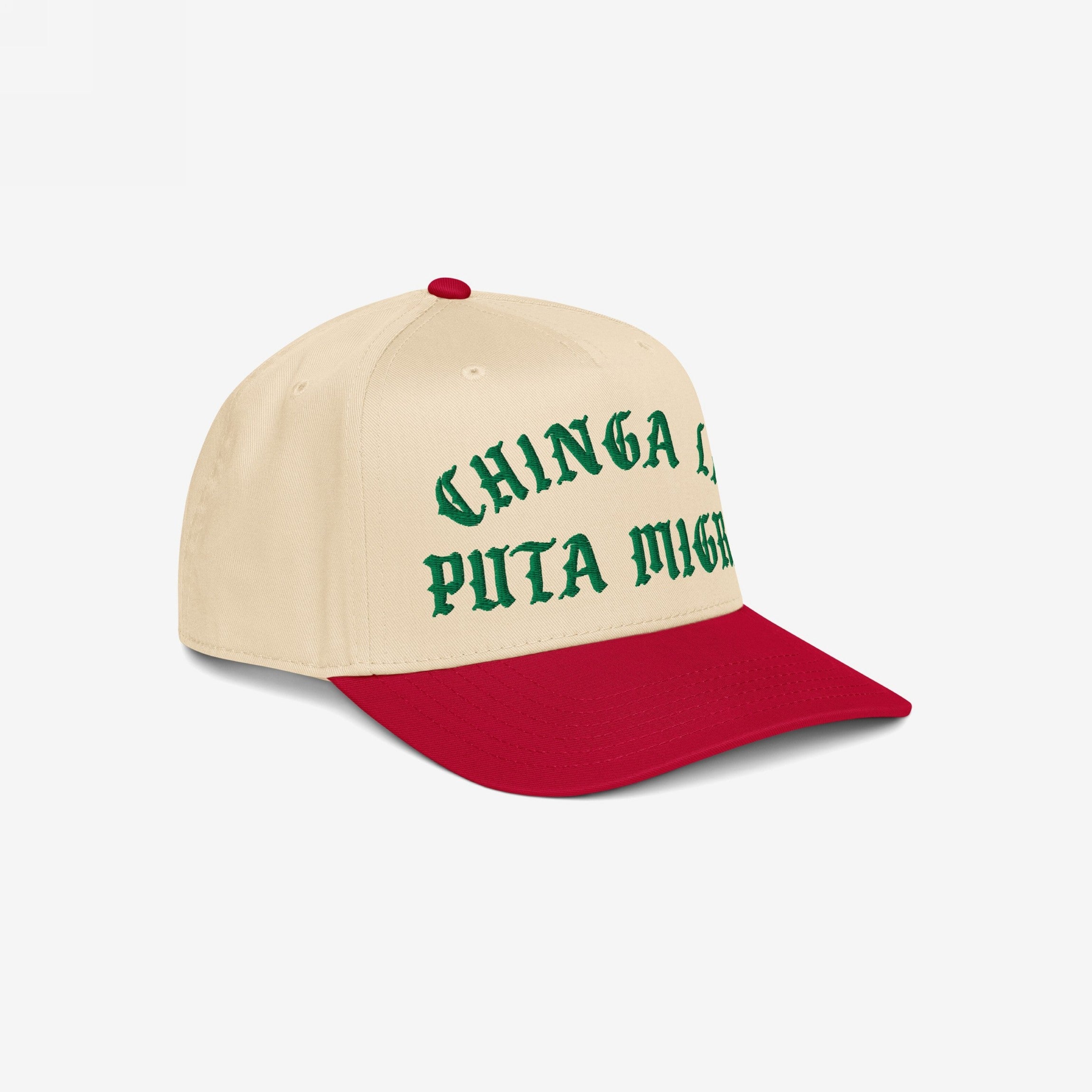 Chinga La Migra Hat: Two-tone baseball cap with cream crown and red brim, featuring green Old English-style embroidered phrase CHINGA LA PUTA MIGRA, symbolizing anti-fascist protest and immigrant rights advocacy.