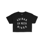 Chinga La Migra Women's Baby Tee, featuring bold white Old English lettering stating “CHINGA LA PUTA MIGRA,” embodies a r