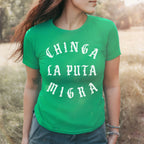 Person wearing the Chinga La Migra Women's Baby Tee with bold, white gothic text stating CHINGA LA PUTA MIGRA, embodying a statement against ICE, perfect for activists and supporters of equality.