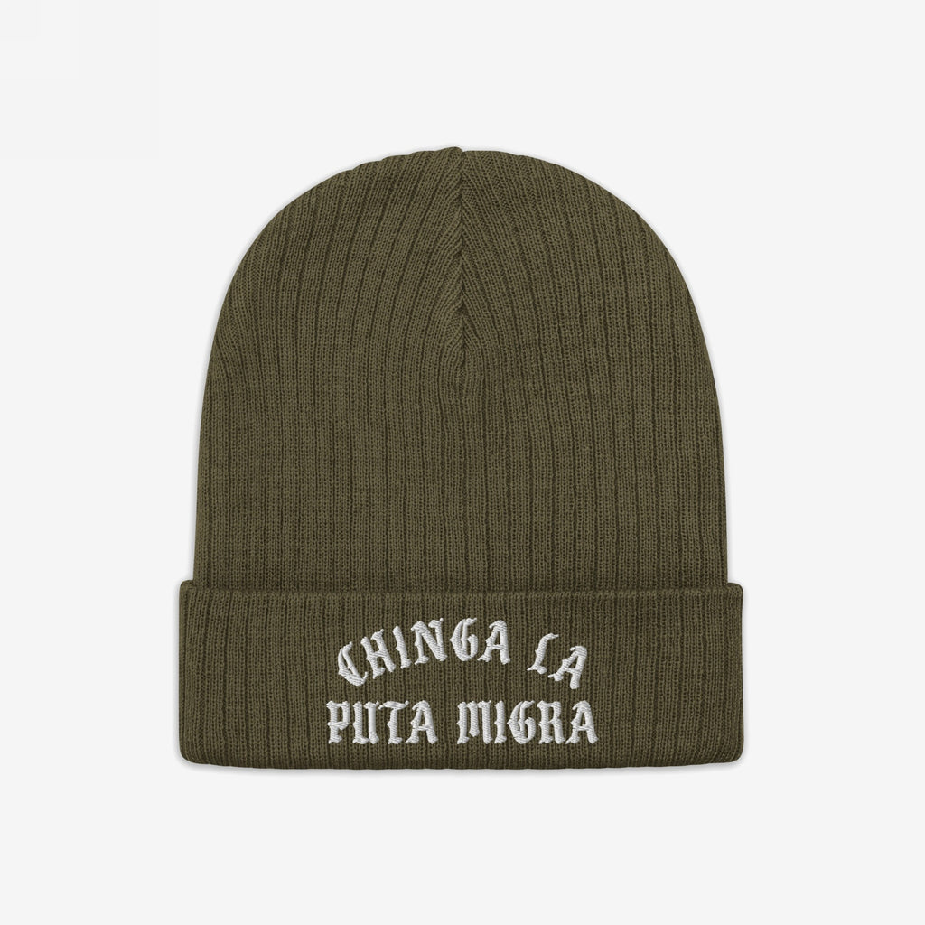 Olive-green rib-knit beanie titled Chinga La Migra Hat, features bold white Old English embroidery stating “CHINGA LA PUTA MIGRA” on the front cuff, symbolizing defiance against ICE/CBP.