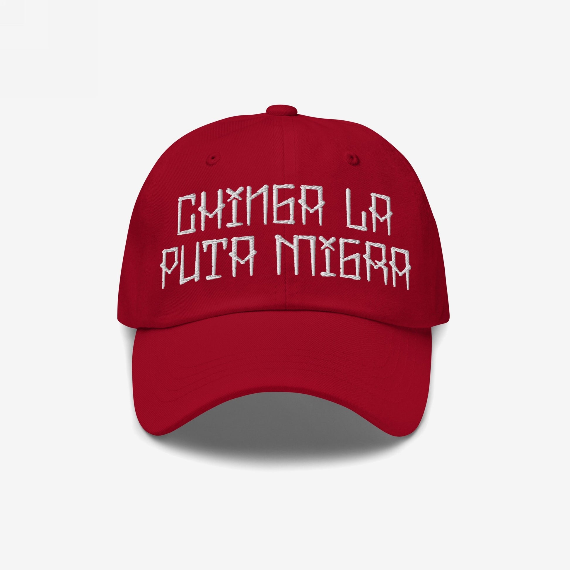 Red baseball cap with bold, white embroidered text Chinga La Puta Migra. The Chinga La Migra Hat is a defiant stance against immigration authorities, embodying resistance and solidarity against oppression.