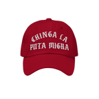 Chinga La Migra Hat features bold white embroidery on a red baseball cap, conveying an anti-fascist protest message. Perfect 