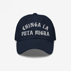 Navy-blue Chinga La Migra Hat with bold Old English-style white embroidery, embodying anti-fascist sentiment. Ideal for protest-minded individuals advocating immigrant rights.