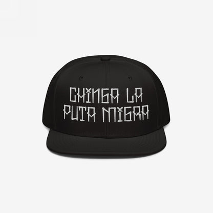 Black flat-brimmed baseball cap with bold white embroidery Chinga La Migra, symbolizing resistance against oppressive immigration systems.