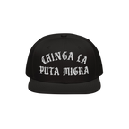 The Chinga La Migra Hat features bold, white Old English embroidery on the front, delivering a powerful anti-fascist message,