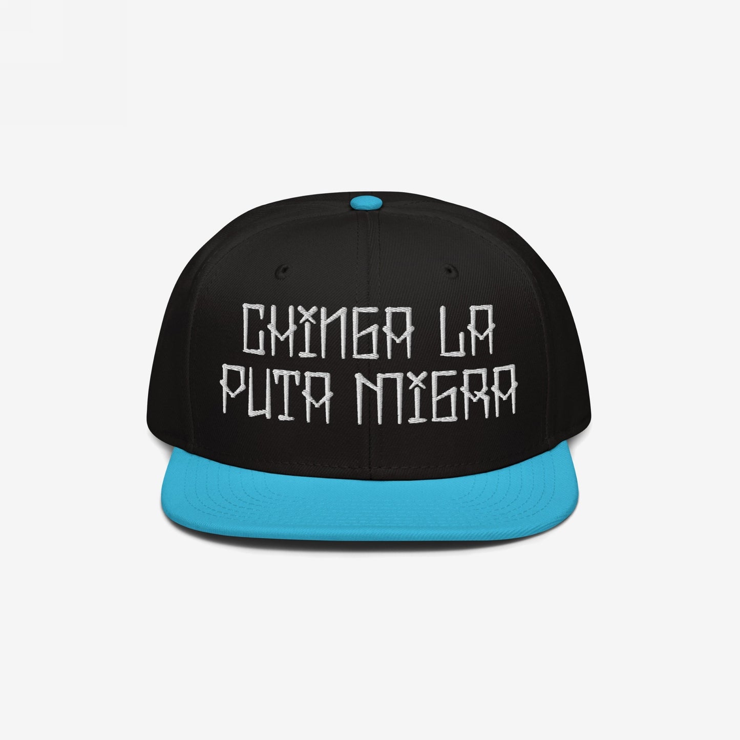 Snapback-style Chinga La Migra Hat with a black crown and turquoise brim, featuring the bold, embroidered phrase “CHINGA LA PUTA MIGRA” in white, symbolizing resistance against oppressive immigration systems.