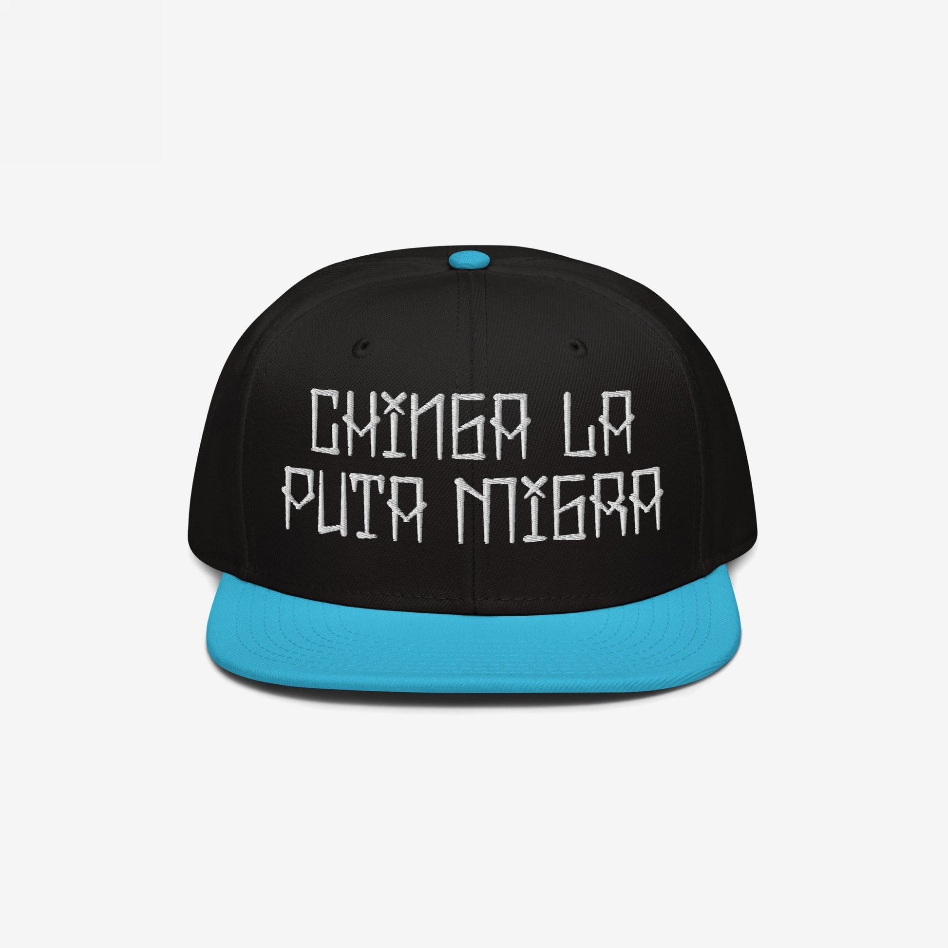 Snapback-style Chinga La Migra Hat with a black crown and turquoise brim, featuring the bold, embroidered phrase “CHINGA LA PUTA MIGRA” in white, symbolizing resistance against oppressive immigration systems.