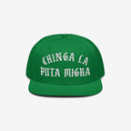Chinga La Migra Hat: A green, flat-brimmed snapback cap featuring bold, white Old English embroidery with an anti-fascist message, symbolizing immigrant rights and resistance against CBP/ICE.
