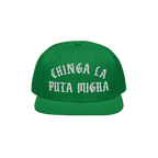 Chinga La Migra Hat: A green, flat-brimmed snapback cap featuring bold, white Old English embroidery with an anti-fascist mes